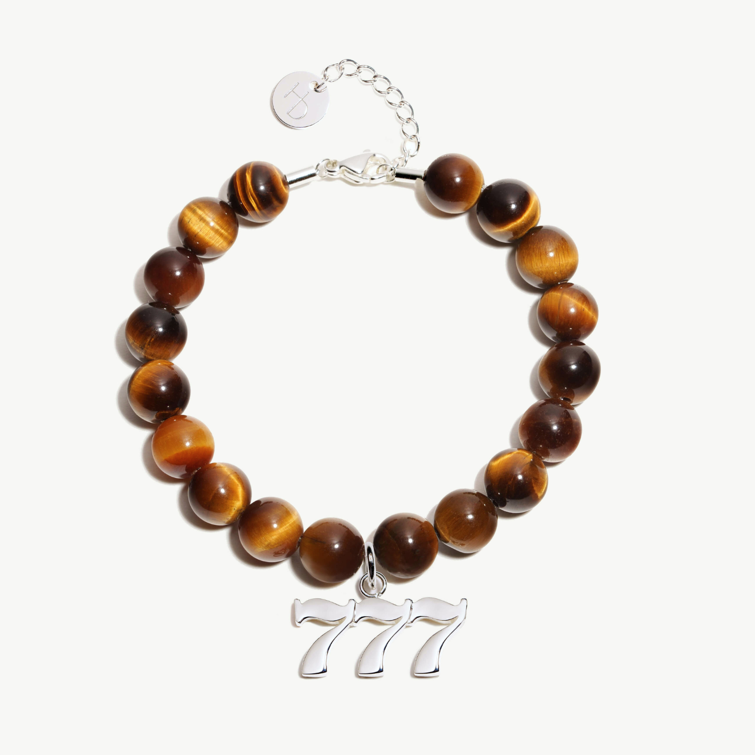 777 Tigers Eye beaded bracelet with adjustable clasp closure. 777 Silver Charm