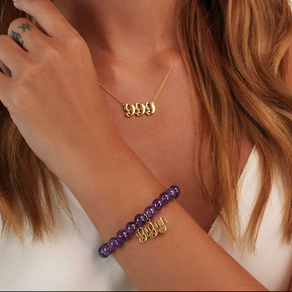 Model wearing a 999 gold bracelet with a matching 999 gold necklace