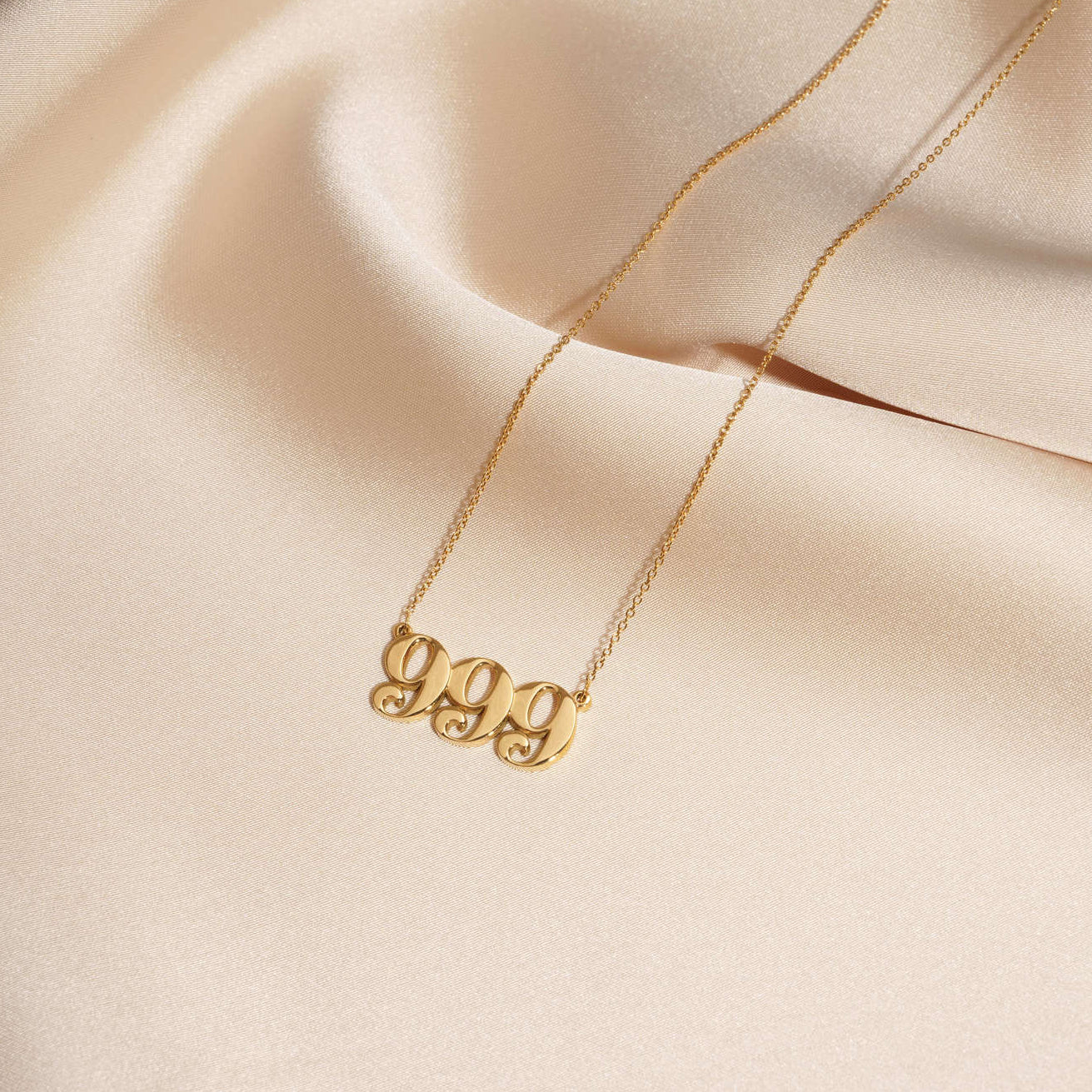 999 necklace gold with unique design on silk
