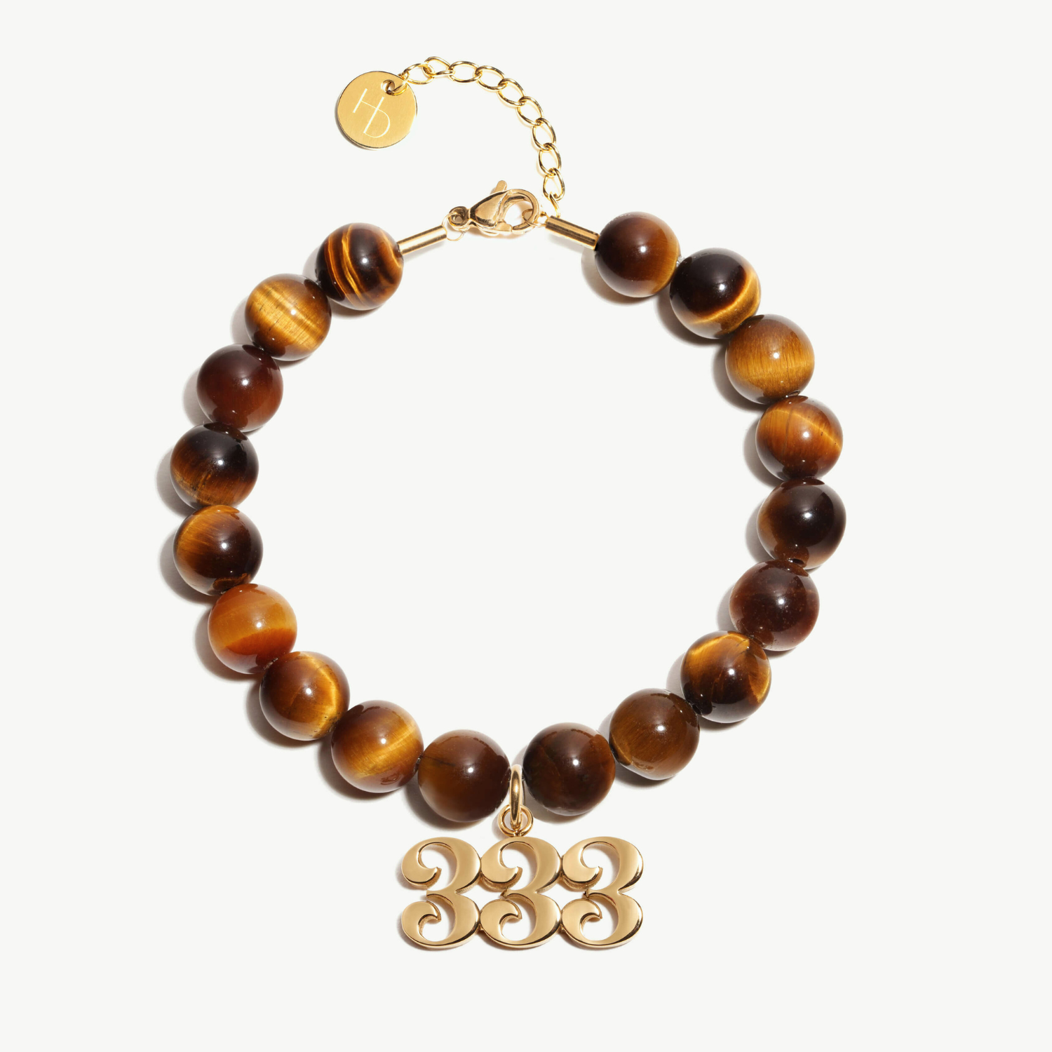 333 Tigers Eye beaded bracelet with adjustable clasp closure. 333 Gold Charm
