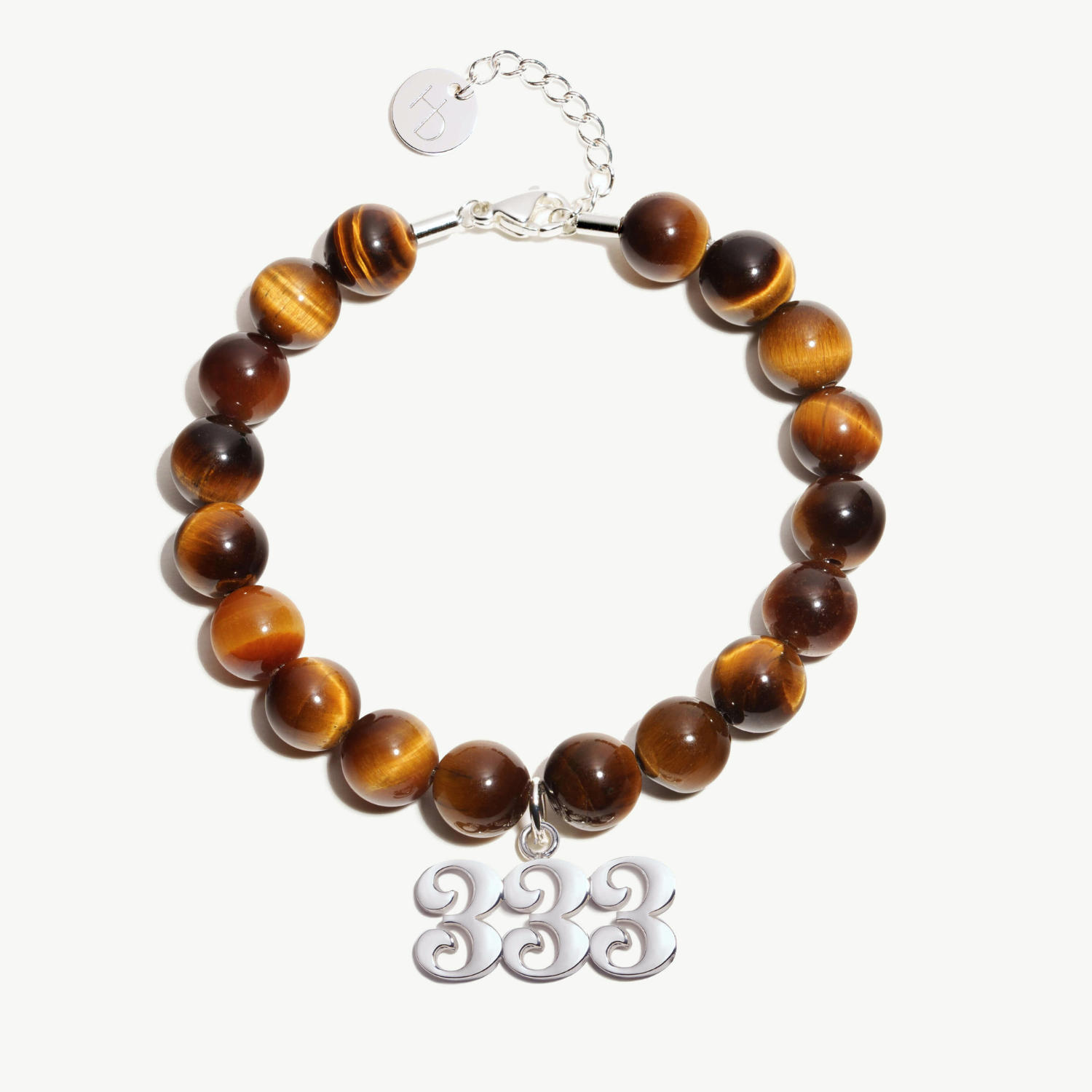 333 Tigers Eye beaded bracelet with adjustable clasp closure. 333 Silver Charm
