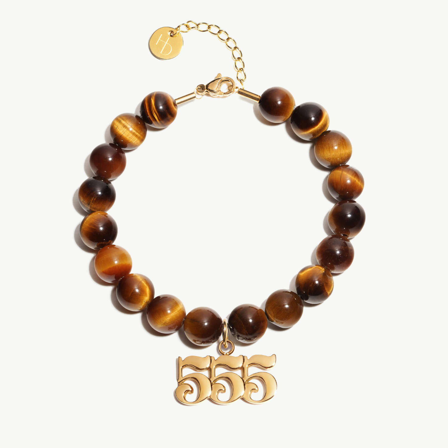 555 Tigers Eye beaded bracelet with adjustable clasp closure. 555 Gold Charm

