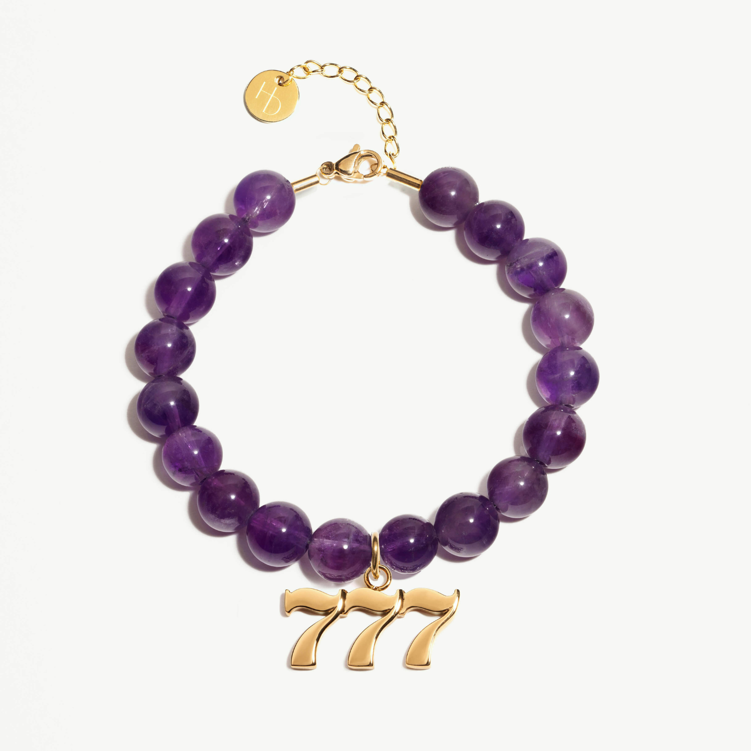 777 amethyst beaded bracelet with adjustable clasp closure. 777 gold charm
