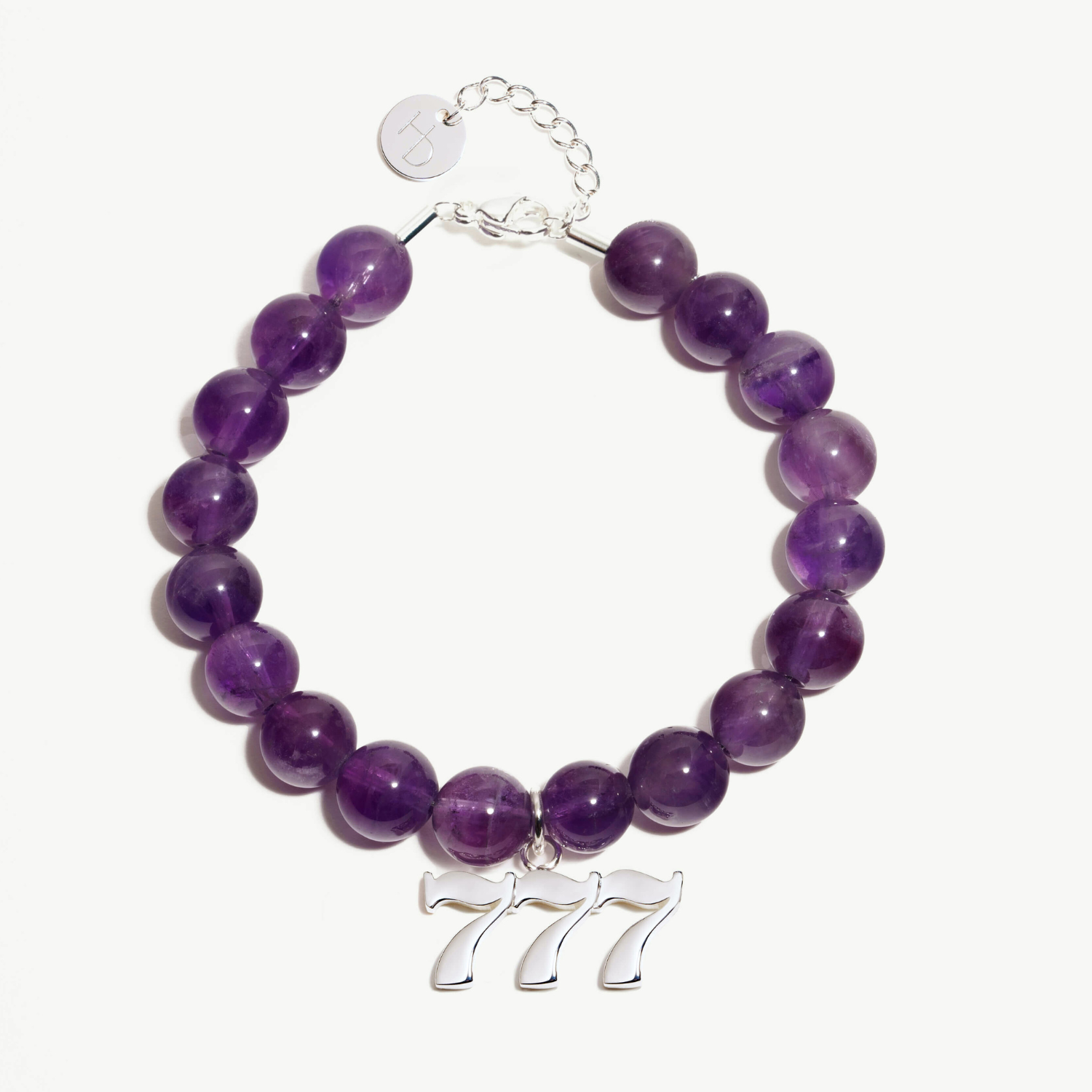 777 Amethyst beaded bracelet with adjustable clasp closure. 777 Silver Charm
