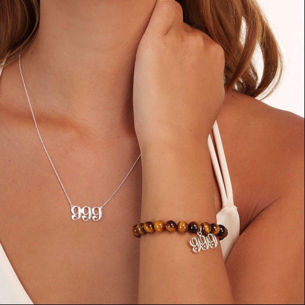 Model wearing a Tigers Eye 999 Silver bracelet with a matching 999 Silver necklace
