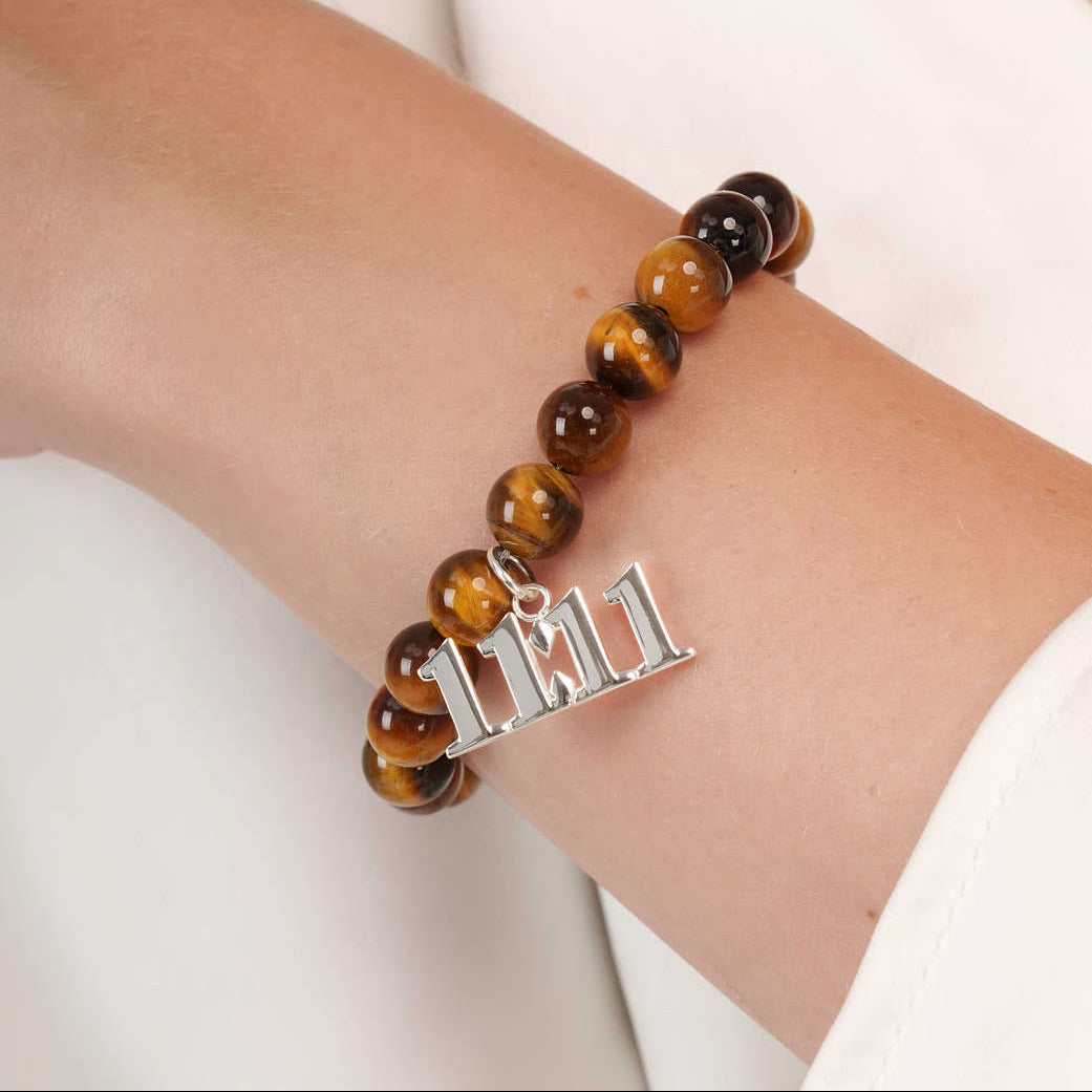 High quality Tigers Eye beads with dangling 11:11 Silver charm on wrist
