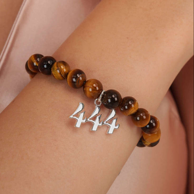 High quality Tigers Eye beads with dangling 444 Silver charm on wrist
