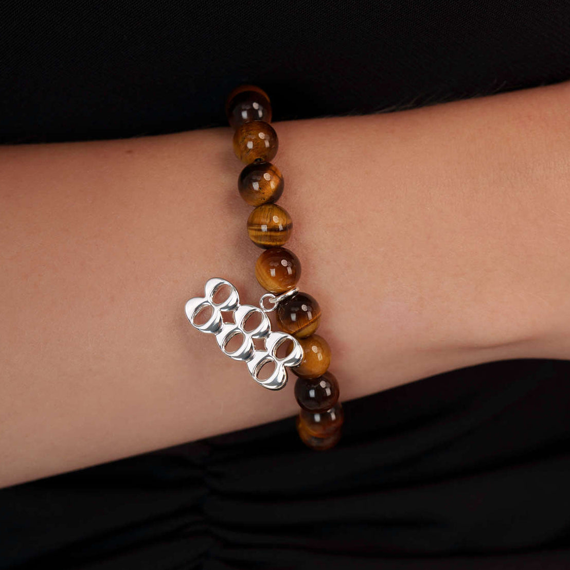 High quality Tigers Eye beads with dangling 888 Silver charm on wrist
